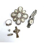 A 925 silver Celtic cross pedant; together with a 925 silver ring with bow design set with white