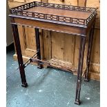 A mahogany occasional table, the top with pierced gallery, raised on square section pierced legs,