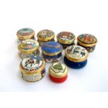 A collection of nine Halcyon Days Christmas themed lidded trinket boxes