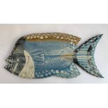 A large carved wooden painted wall hanging fish, 75cmL