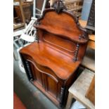 A late Victorian mahogany chiffonier, serpentine front with single drawer, cupboards below flanked