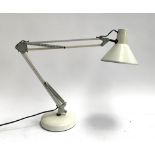 A large white anglepoise lamp
