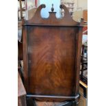 A 20th century corner cupboard with broken swan neck pediment, 55cmW