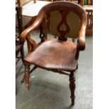 A 19th century mahogany and elm open armchair, shaped seat with turned legs and H stretchers, vase