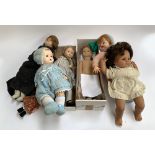 A West German composite doll; several rubber dolls; two cloth dolls etc
