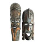 Two wooden carved African masks, 59cmH and 49cmH (2)