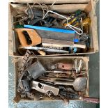 Two small wooden crates filled with various vintage tools, including screwdrivers, planes, hand