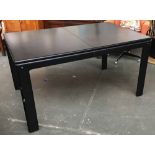 A mid century 1970s black Flamingo extending table designed by Finnish Interior decorator Eero