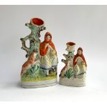 Two Staffordshire flatback Red Riding Hood spill vases, 26cmH and 17cmH