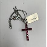 A 925 silver and pink stone crucifix, approx. 3cmL, on a 925 silver chain
