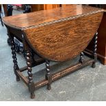 An oval oak gateleg table, on barleytwist supports, 102cmW