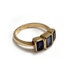A 9ct gold ring set with three amethysts, size O, 3.6g