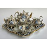 A 19th century part tea service, heightened in gilt