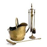 A brass helmet coal scuttle, together with a set of fire irons, and a further fire shovel