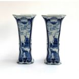 A pair of Delft vases depicting windmills and floral sprays, each marked 'Delft Dec 510' to base,
