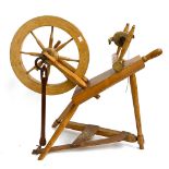 A treadle powered maple spinning wheel