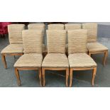 A set of eight beech framed contemporary upholstered dining chairs