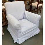 A small armchair, upholstered in blue gingham