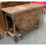 An 18th century oval gateleg table, on barleytwist supports, 86x34x61cmH