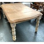 A substantial extending dining table on turned legs, approx. 183x107x77cmH