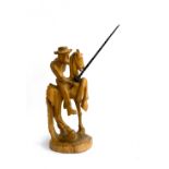 A wooden carving of Don Quixote, 43cmH, 51cmH to tip of lance