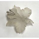 A 14ct white gold, diamond and carved rock crystal brooch in the form of a flower, approx. 5cmL;
