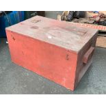 A red painted wooden box containing a large quantity of spanners