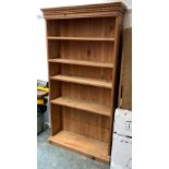 A pine bookcase, with dentil cornice, 106x30x200cmH