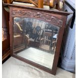 An early 20th century oak wall mirror, with bevelled glass, 57cmH