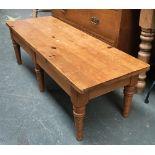 A low pine coffee table, on six turned legs, 130x45x40cmH