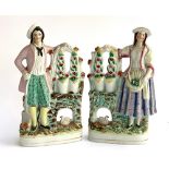 A pair of 19th century Staffordshire flatback figures, a gentleman with spade and lady with fruit, e