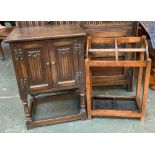 An oak pot cupboard, the doors with linen fold detail, on turned supports and square stretchers,