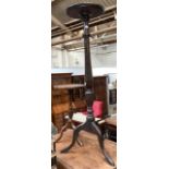 A pot stand with dish top, on turned fluted column and tripod base, 111cmH; together with a