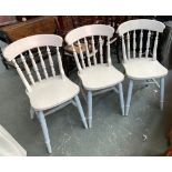 A set of three modern painted stickback kitchen chairs