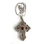 A Stephen Whittard pierced pewter cross set with garnets, 6cmL on a 925 silver chain, 46cmL