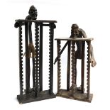 A pair of carved tribal style wooden CD racks, the tallest 82cmH, the other 66cmH