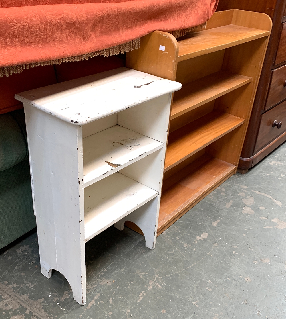 A small white painted bookshelf, 52x30x79cmH; together with one other retailed by Phoenix of