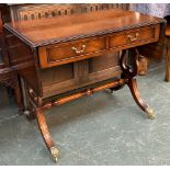 A mahogany sofa table, two drawers on swept legs, brass pad feet and casters, 91x54x75cmH