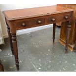 A 19th century mahogany desk/side table, moulded top over two frieze drawers, on turned legs,