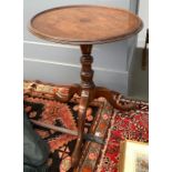 A Regency and later tripod table, dish top on turned column and cabriole legs, on brass casters,