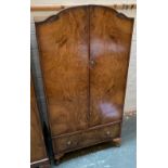 A 1950s walnut veneer wardrobe, with drawer below, 69x45x137cmH