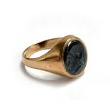 A 9ct gold signet ring, designed with an oval hematite intaglio depicting a gentleman in profile