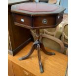 A small octagonal drum table, on four swept legs, 61cmH