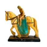 An early 20th century plaster figure of Godiva riding a horse, 47cmH