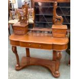 A Duchess dressing table, with adjustable mirror and four pier drawers, over a single drawer and