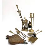 A mixed lot of brass fire tools, to include several sets of fire irons, bellows etc