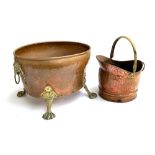 A copper oval coal bucket, with brass lion mask loop handles and brass shell capped paw feet, 46cmW;