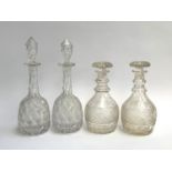 A pair of pineapple cut glass decanters, 36cmH, together with a matching claret decanter, 38cH, toge