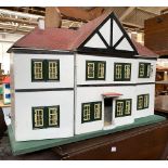 A break front dolls house, tiled roof with six rooms, 68cmW; together with some contents