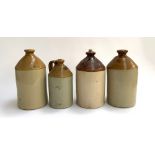 Four stoneware flagons, one with loop handle marked 'Sanitas', the largest by C. Garder & Sons,